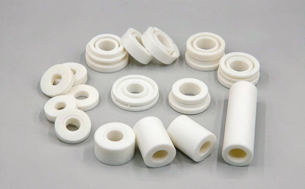White PEEK plastic CNC machined insulating bushings, standoffs and spacers